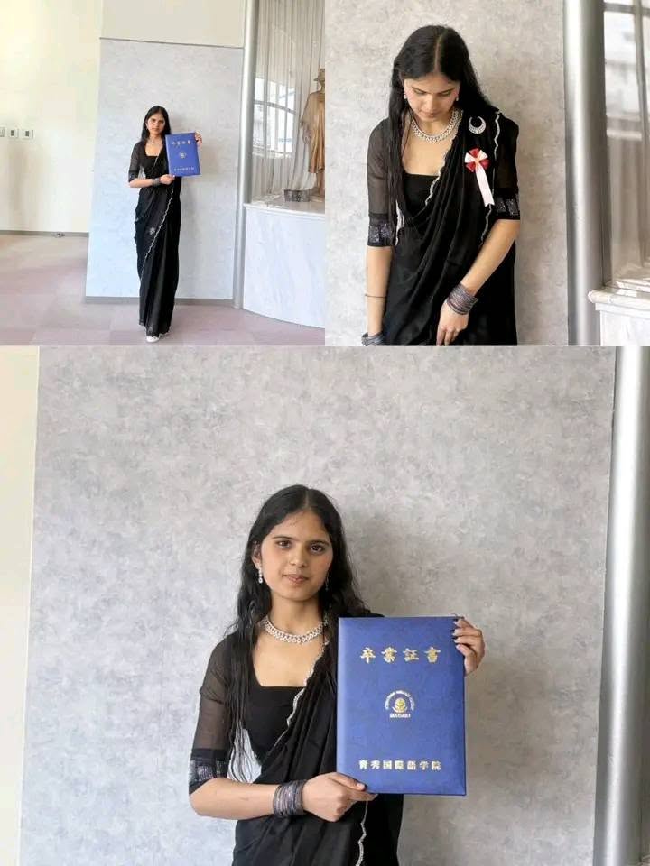 Birkausalya student with her graduation certificate